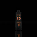 Shampoo bottle labeled 'ELEVEN E5' on a black background